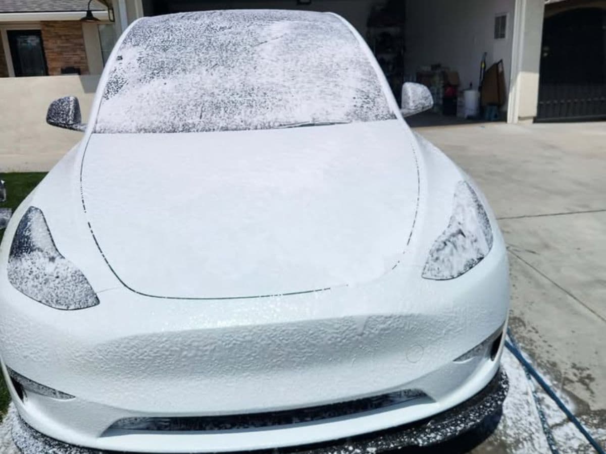 Tesla covered in foam during a wash