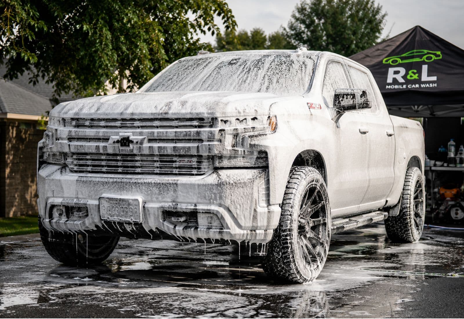 Car covered in foam during a mobile hand wash in La Puente